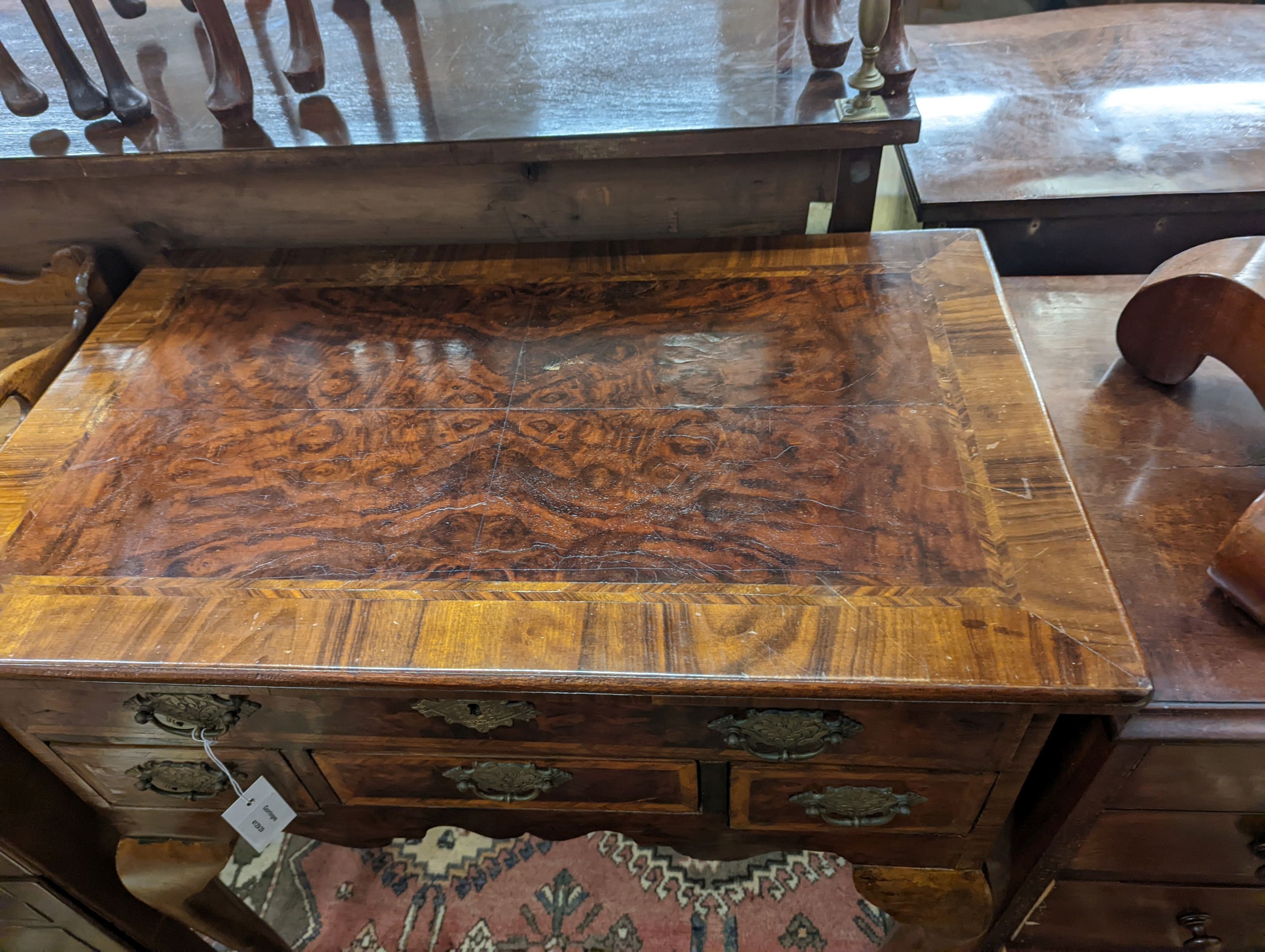 A George I style banded figured walnut lowboy, width 74cm, depth 44cm, height 76cm